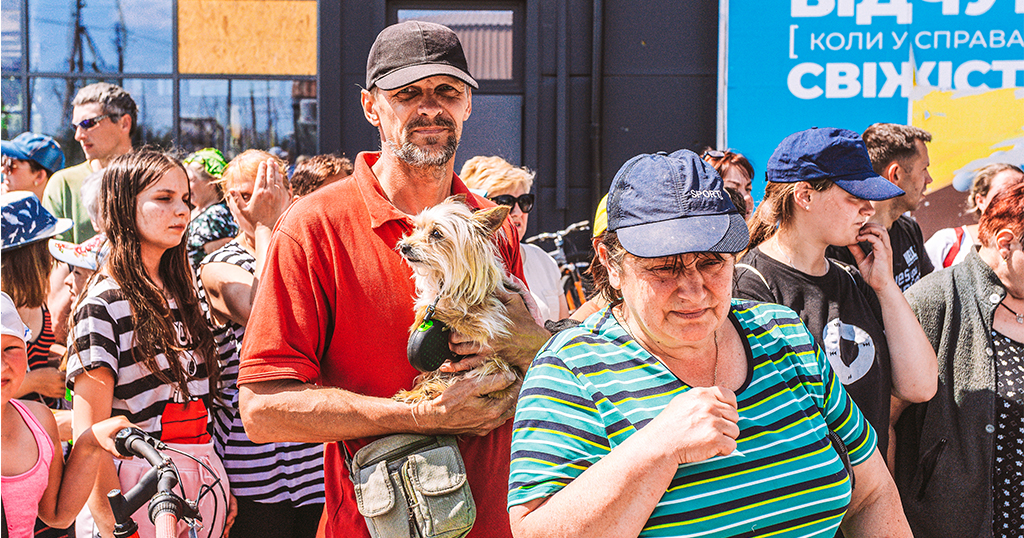 People in queue receiving help from charity project Pets Patrol